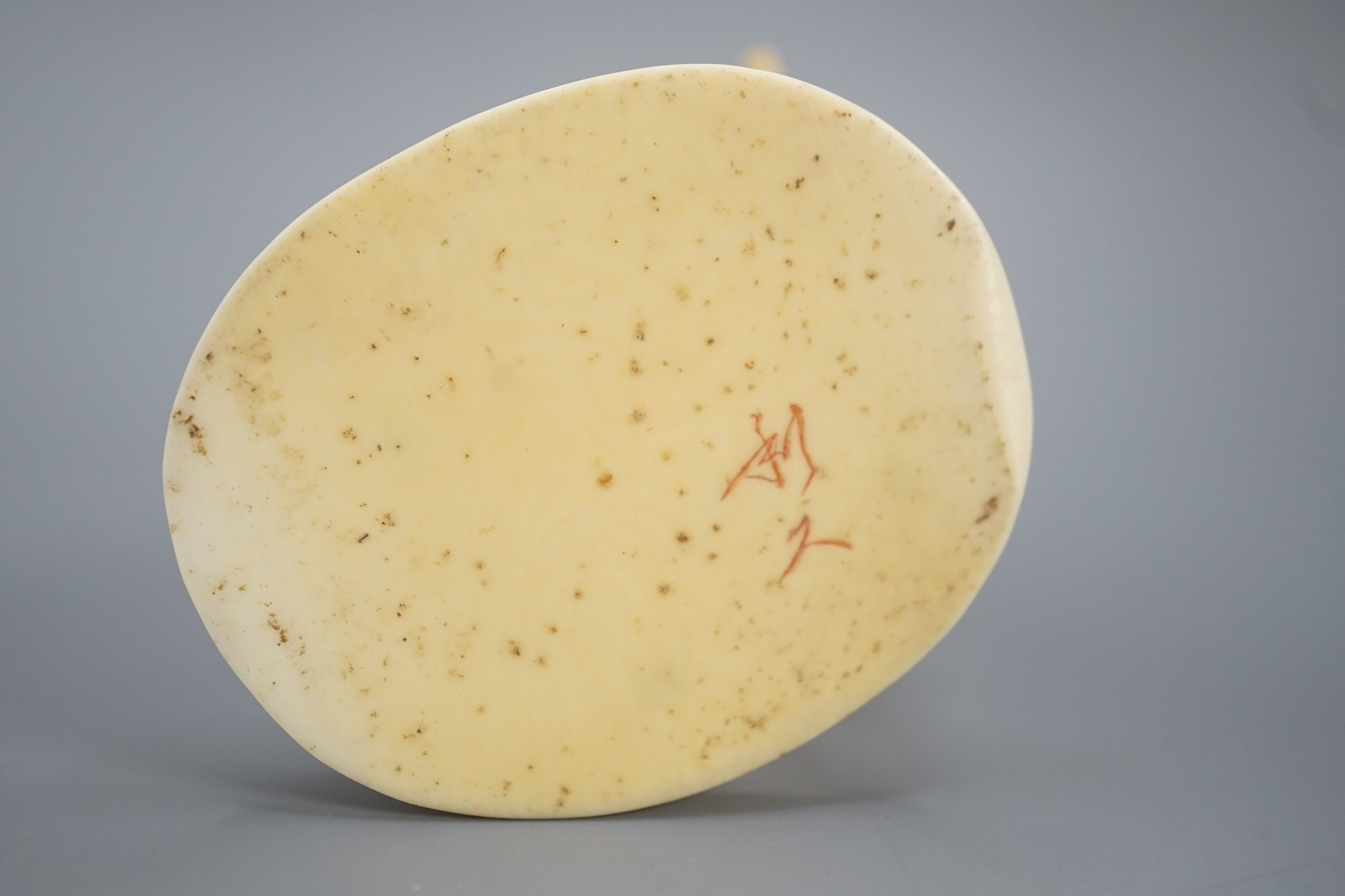 A Japanese ivory okimono of a monkey trainer, signed, Meiji period, 7.7 cm